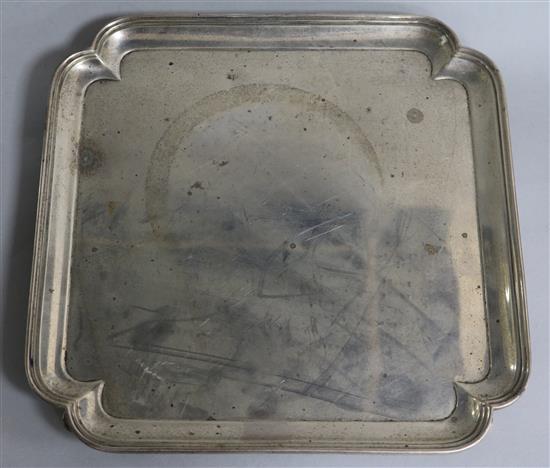 A George V silver square salver with inswept corners by Thomas Bradbury, Sheffield, 1920, 22.7 oz.